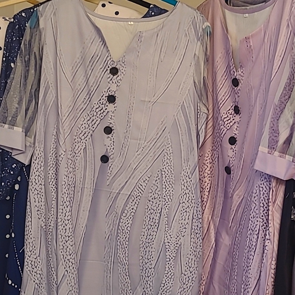 Dress is new with pockets, sheer sleeves, size large